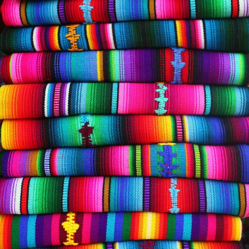 Colorful Mexican style fabric stacked on top of each other