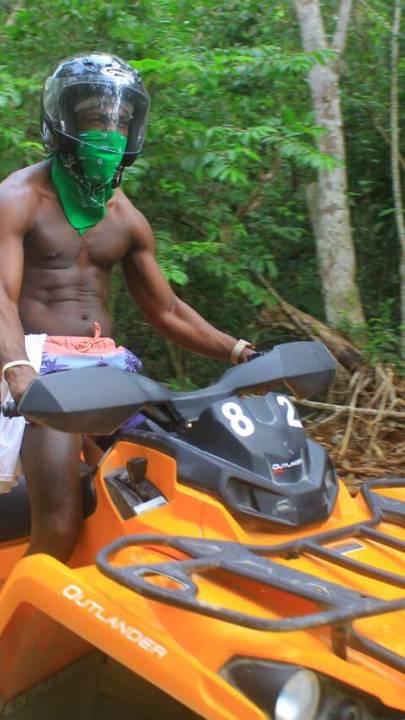 Man and woman riding in an ATV