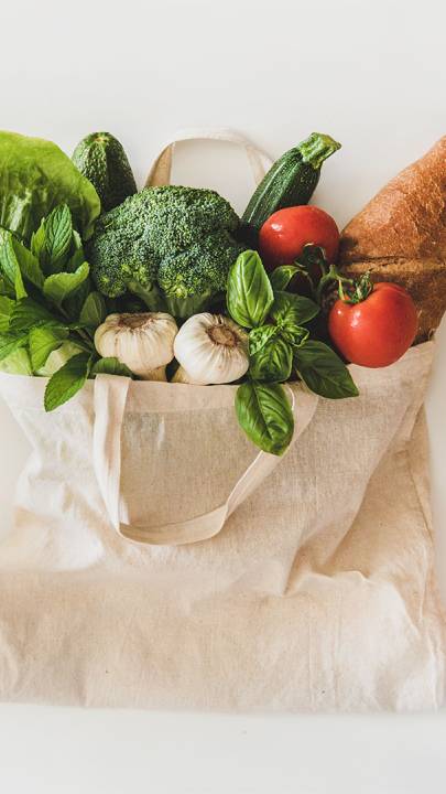 Fruits and vegetables inside tote bags