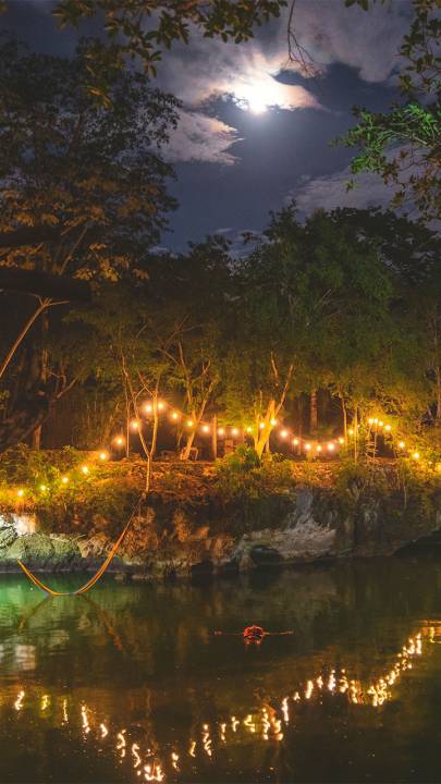 Cenote illuminated by lights
