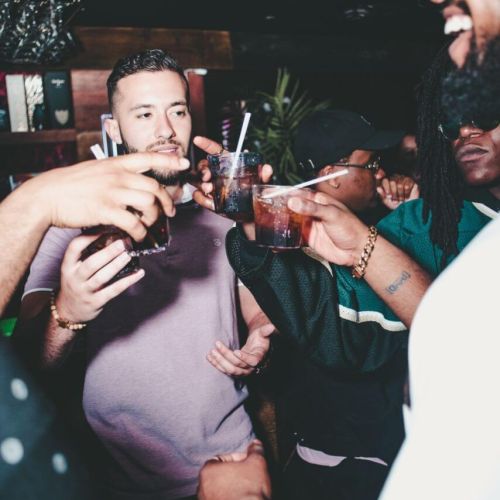 A group sharing drinks at a bar